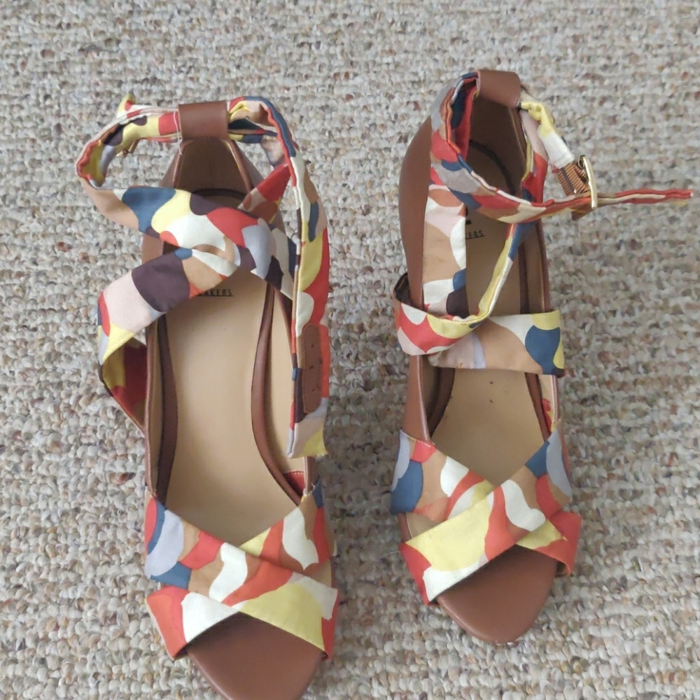 Tan heels with wrap around strap.